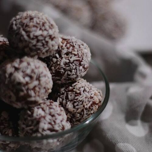 Coconut truffles dusted with cocoa
