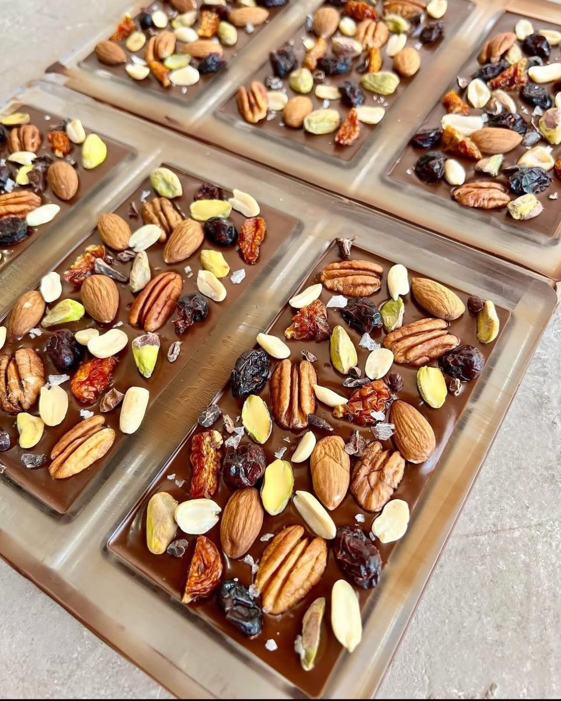 Three Meltova bars loaded with nuts and dried fruit